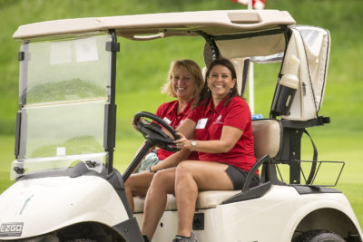 Volunteers Driving Golf Cart